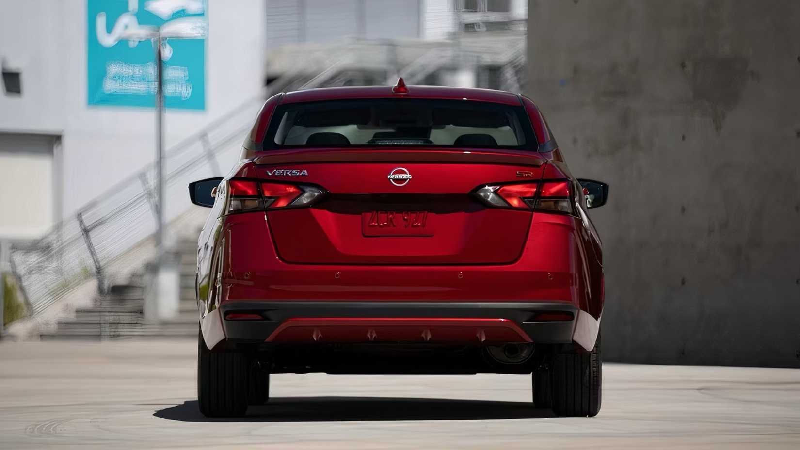 2025 Nissan Versa in red parked 