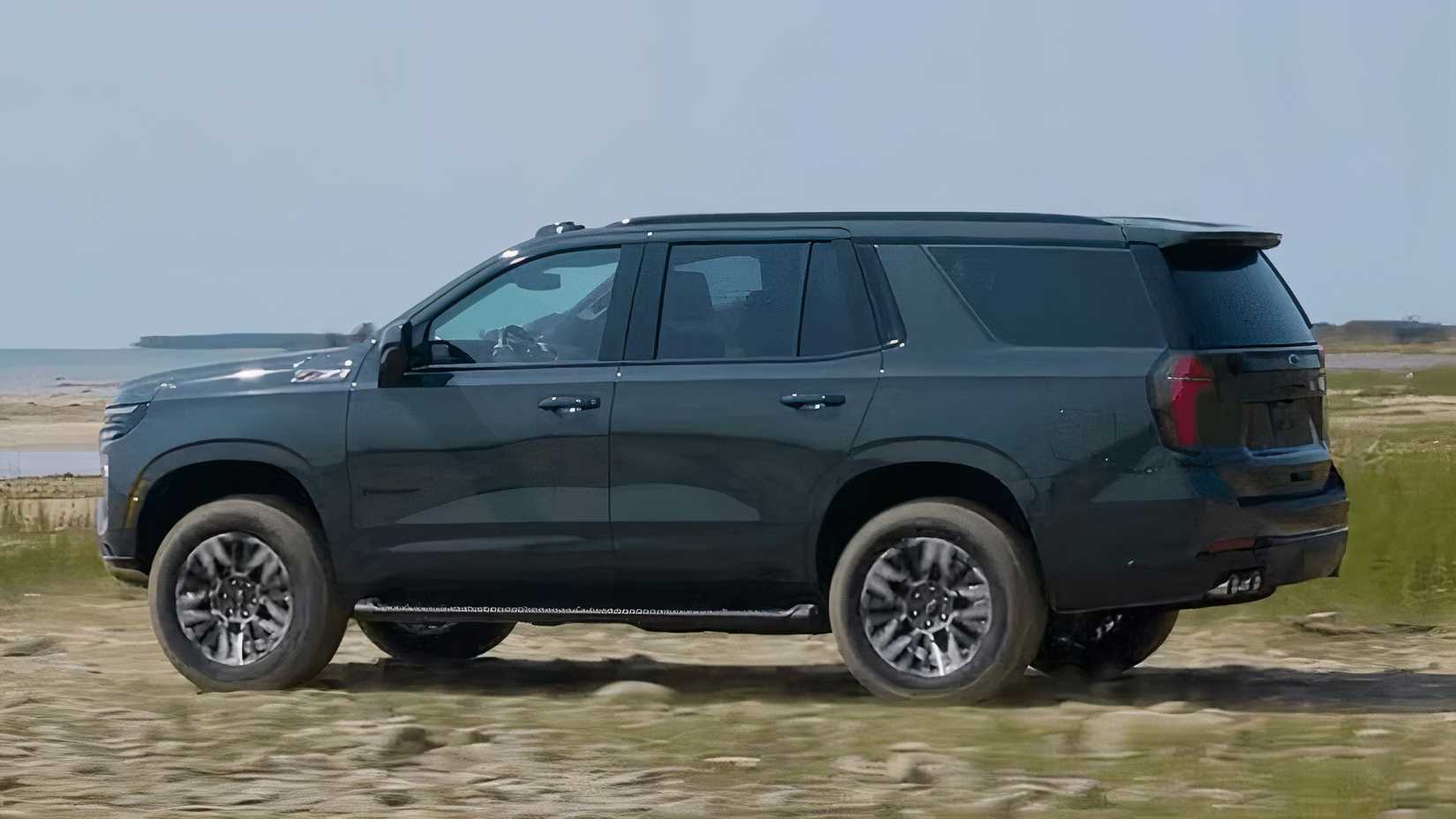 2025 Chevrolet Tahoe in gray parked off-road
