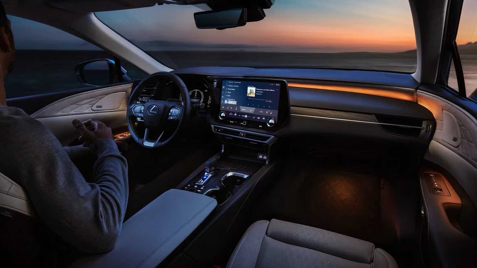 2025 Lexus RX interior showing front cabin, steering wheel and dashboard