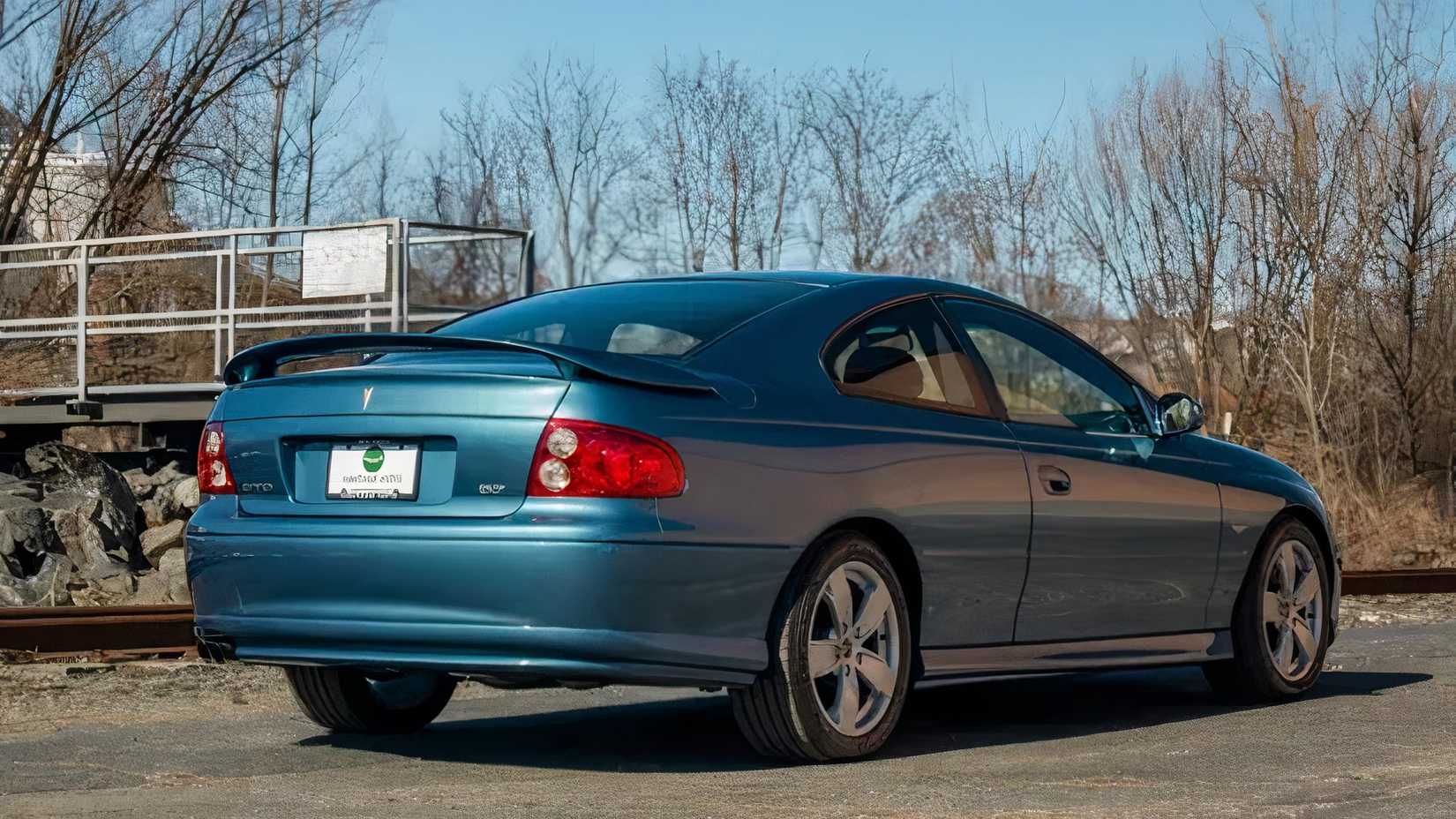 2004 Pontiac GTO in green parked in parking lot