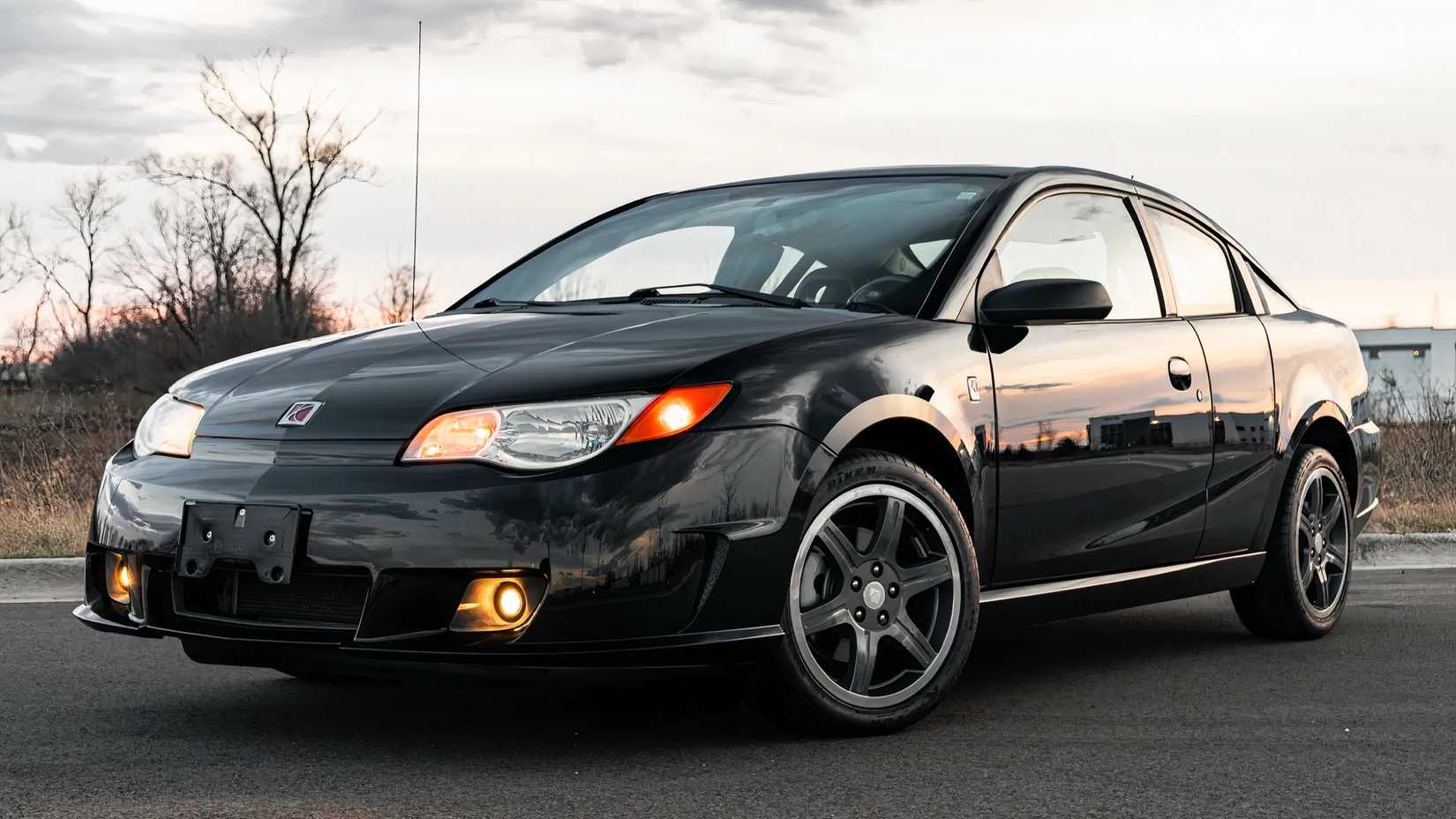 2007 Saturn Ion Quad Coupe Redline Edition in black parked in parking lot