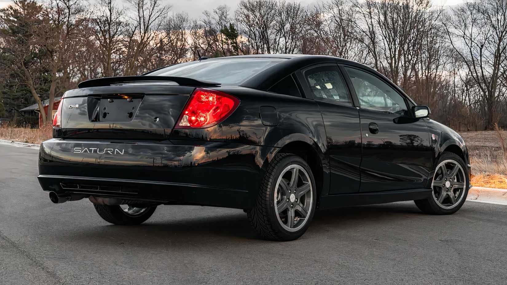 2007 Saturn Ion Quad Coupe Redline Edition in black parked in parking lot
