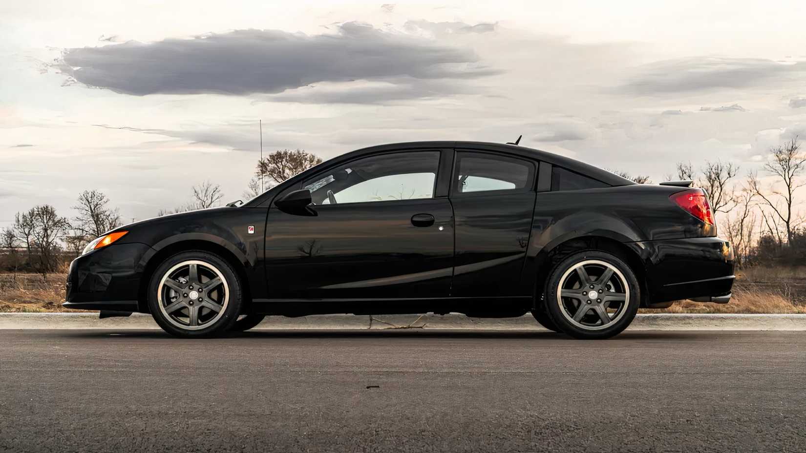 2007 Saturn Ion Quad Coupe Redline Edition in black parked in parking lot