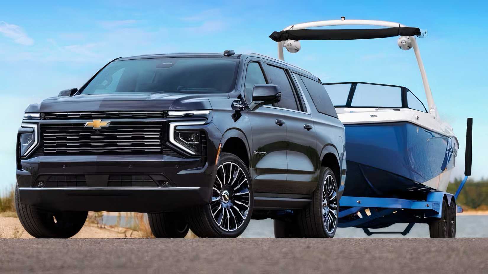 2025 Chevrolet Suburban in black towing boat