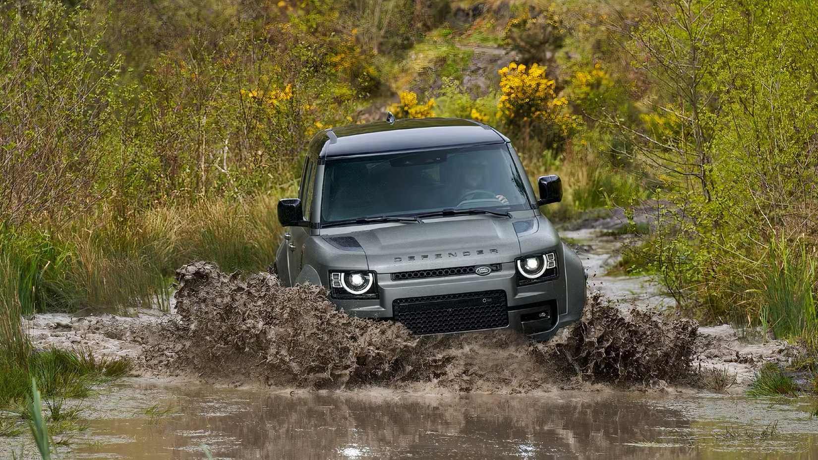 2025 Land Rover Defender OCTA driving through deep water