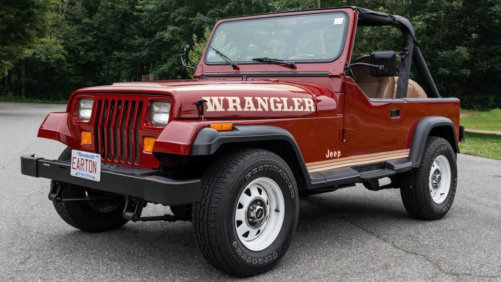 1987 Jeep Wrangler in red parked