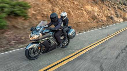 A 2015 Kawasaki Concours riding two-up on a mountain road