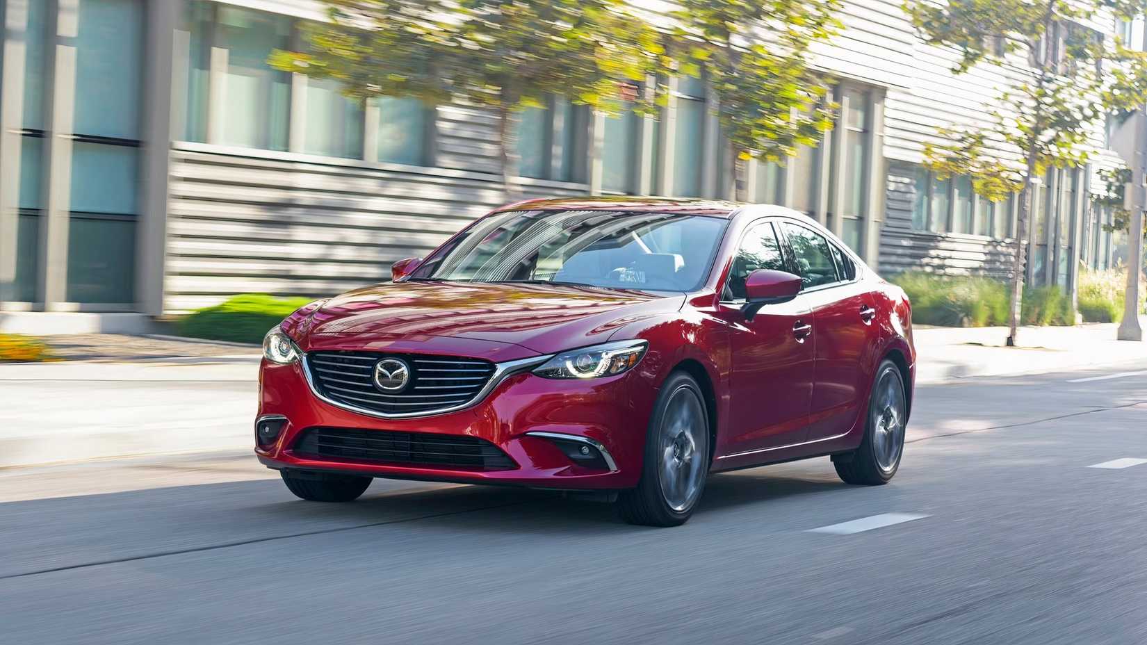 Front 3/4 shot of a 2016 - 2017 Mazda6 driving through city