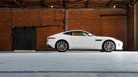 A 2017 Jaguar F-Type from the side in a warehouse