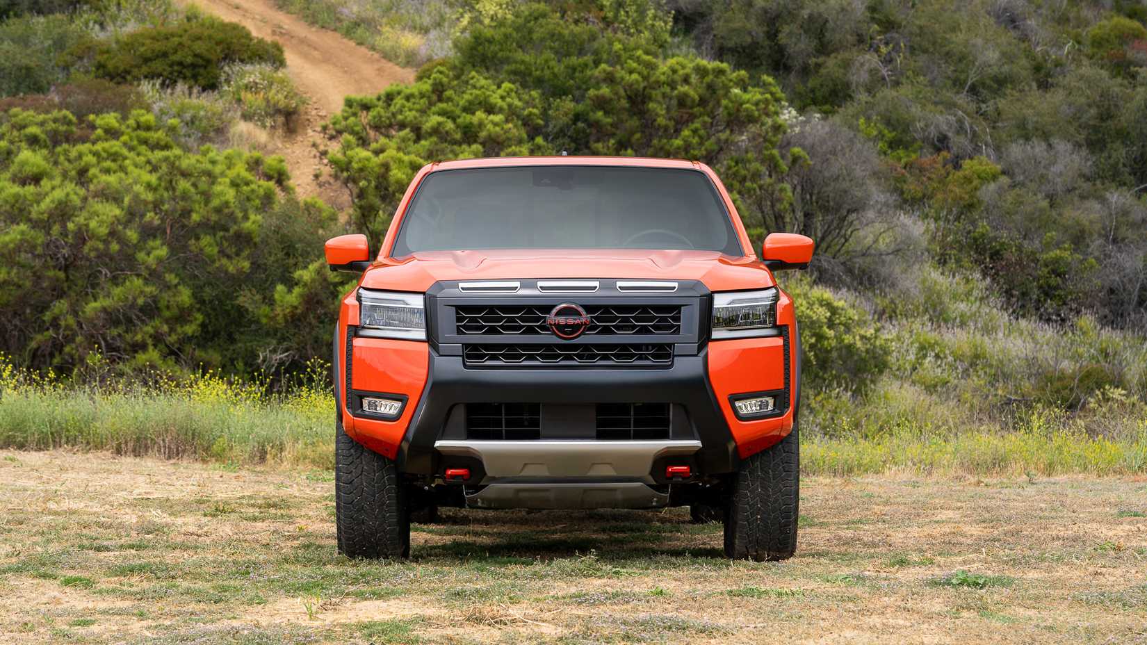 Front shot of a 2026 Nissan Frontier Pro-4X parked off-road