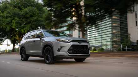 2026 Toyota Grand Highlander in silver being driven on road