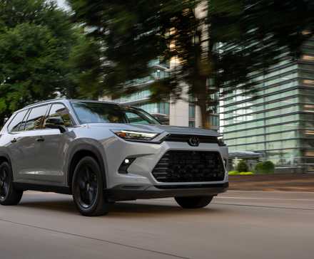 2026 Toyota Grand Highlander in silver being driven on road