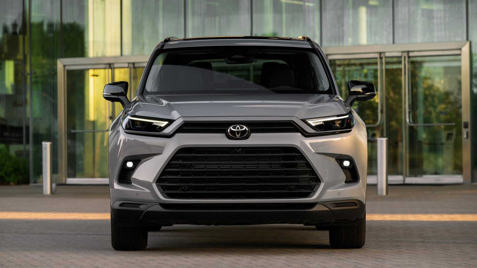 2026 Toyota Grand Highlander front shot parked in front of building