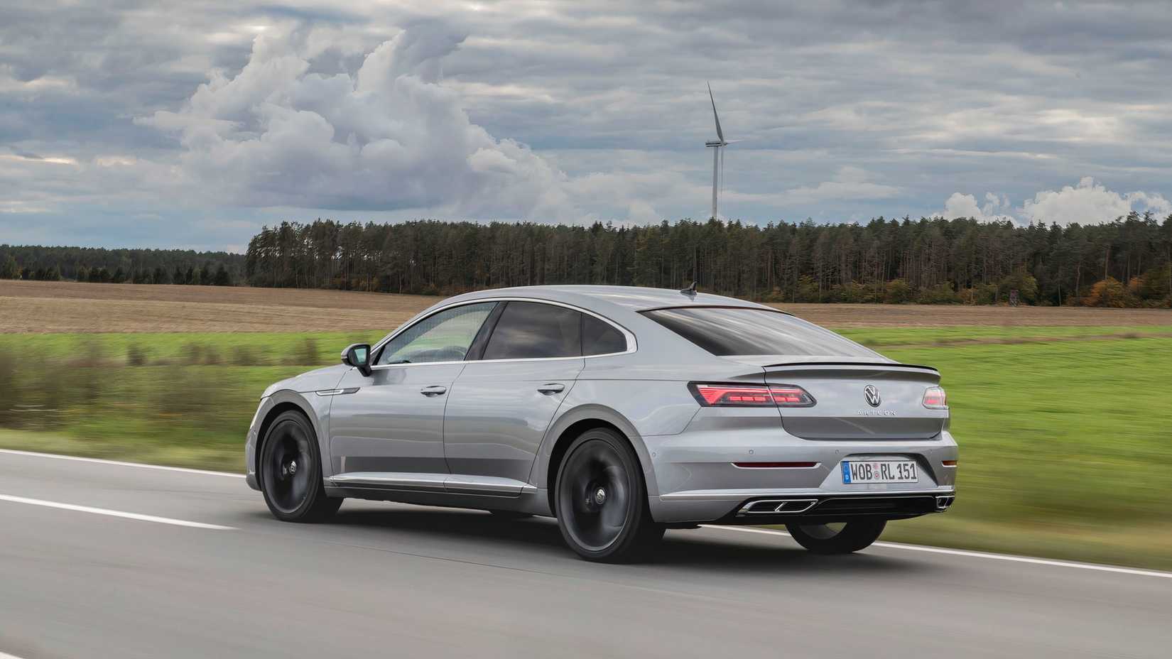 Silver Volkswagen Arteon driving on country road