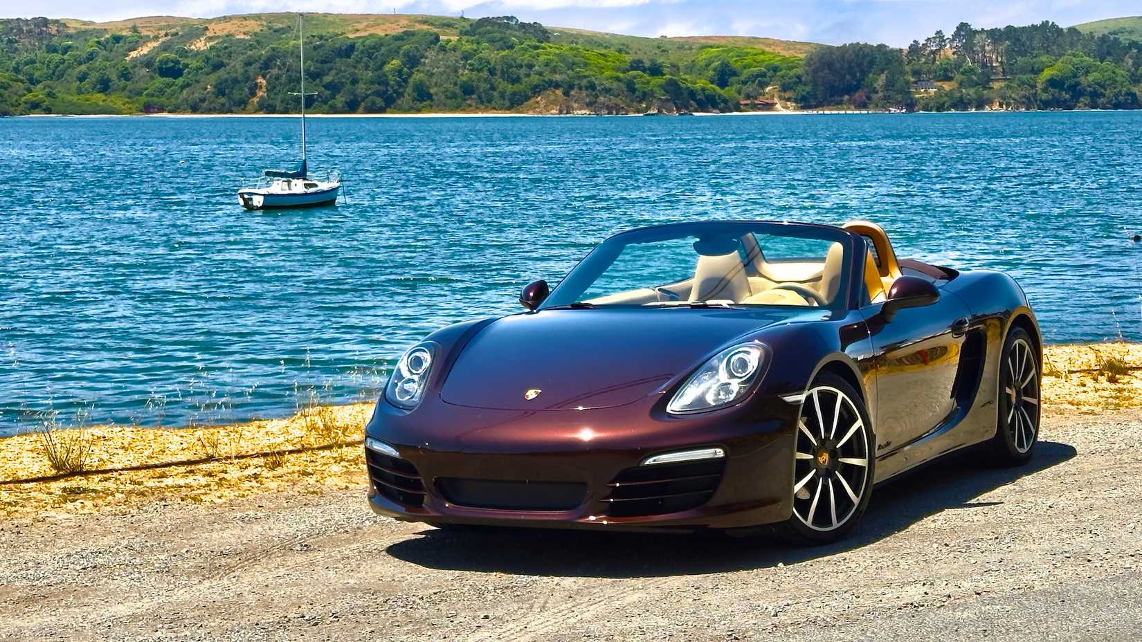 2013 Porsche Boxster front 3/4 shot parked near water