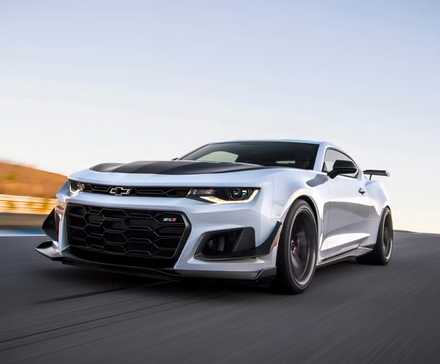 2024 Chevrolet Camaro ZL1 in white driving on track