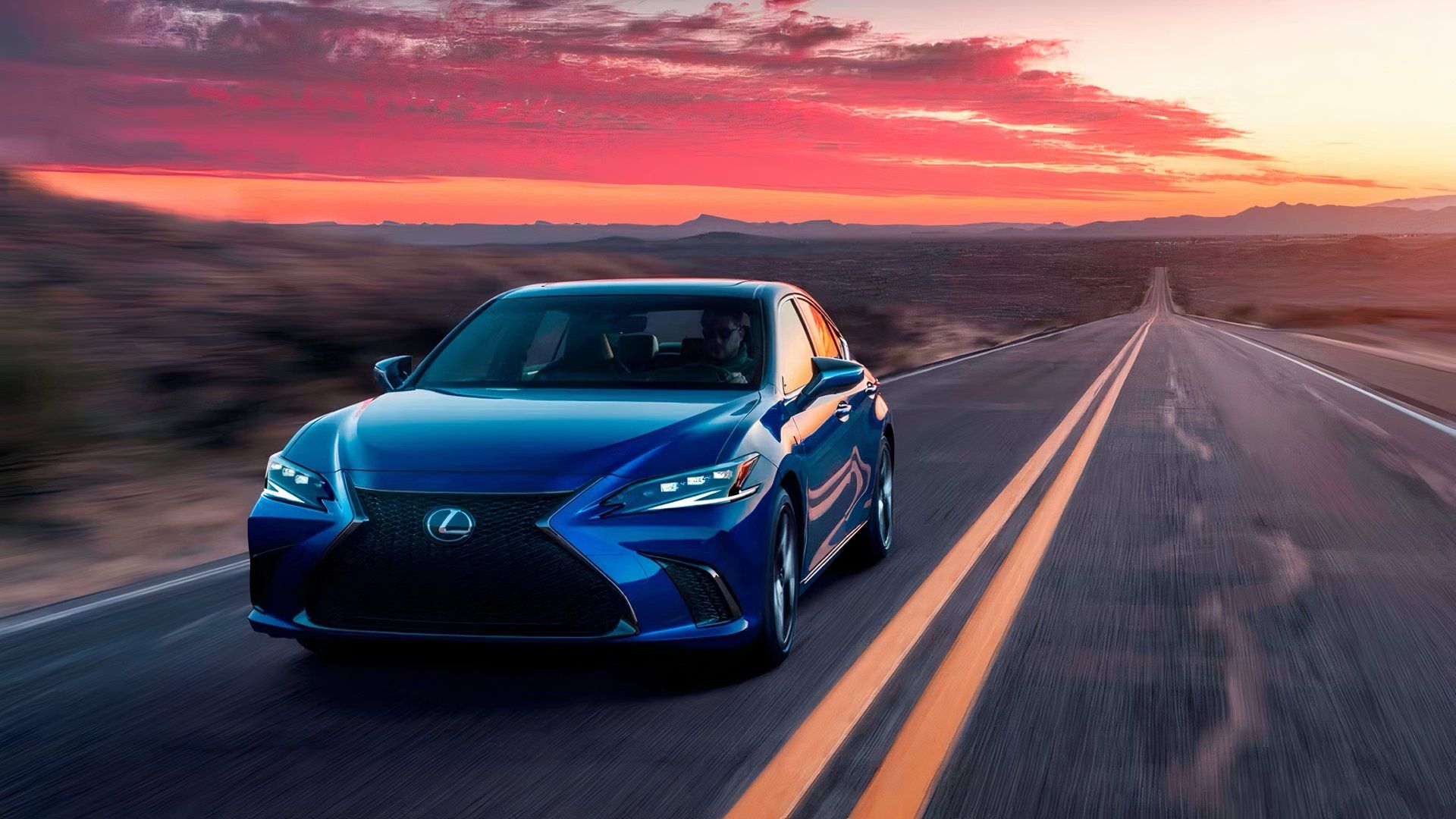 2025 Lexus ES in blue driving on desert road