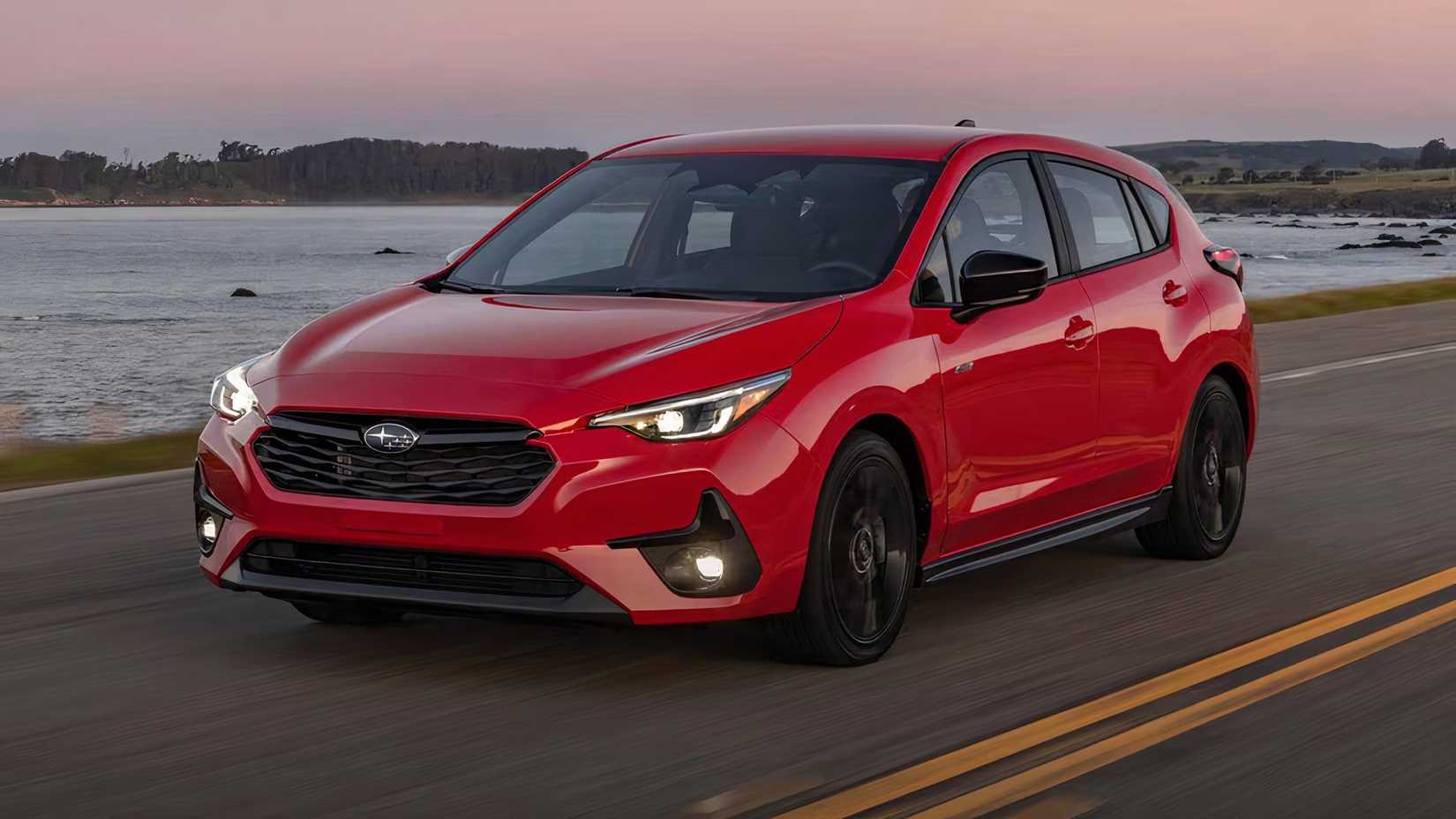 2026 Subaru Impreza RS in red driving on road