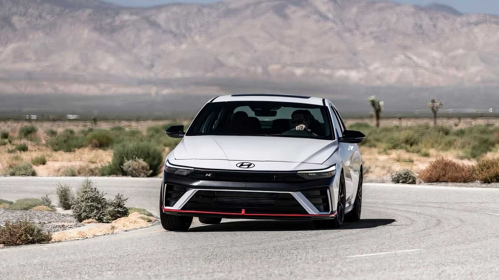 2025 Hyundai Elantra N in white driving on desert road