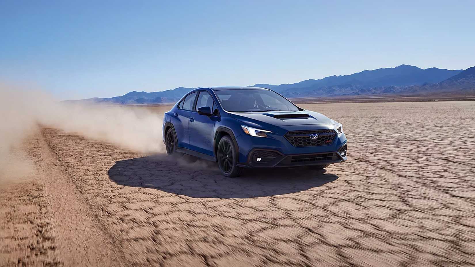 2025 Subaru WRX tS in blue driving across a desert