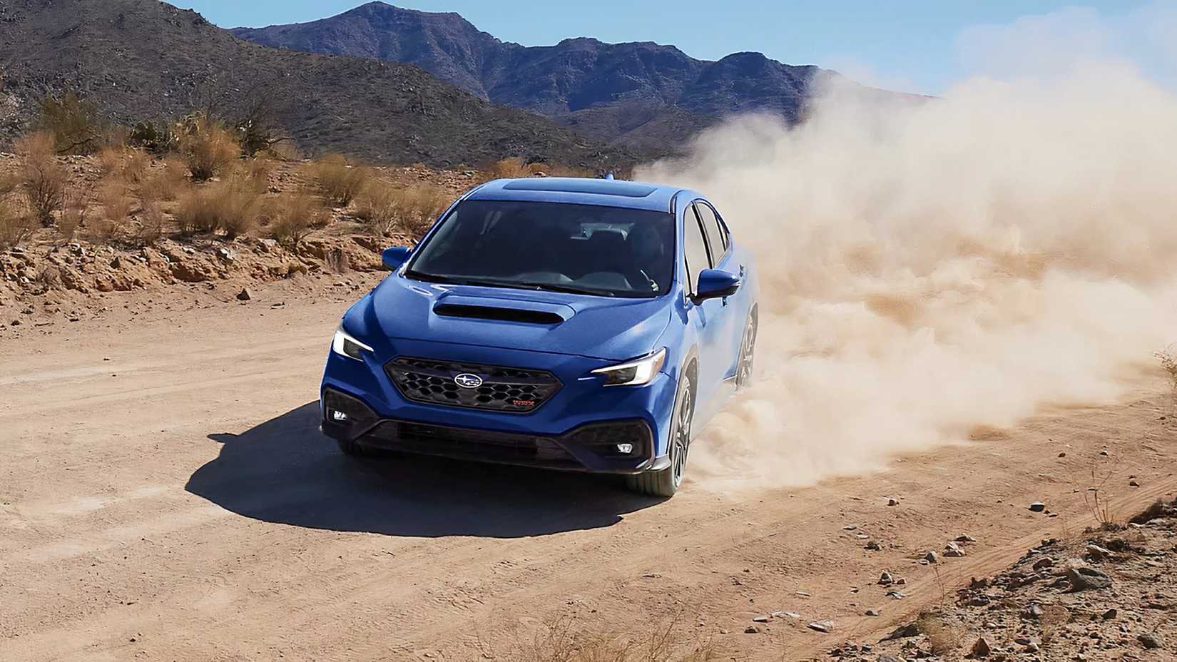 2025 Subaru WRX TR in blue driving off-road