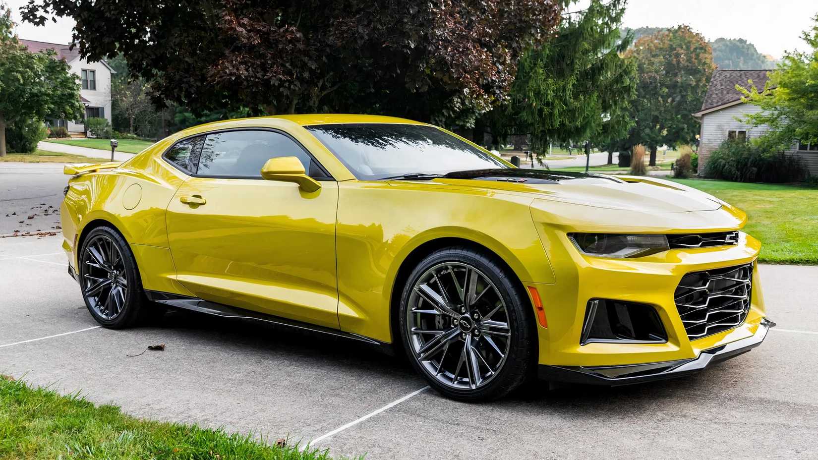 2024 Chevrolet Camaro ZL1 in yellow parked on driveway
