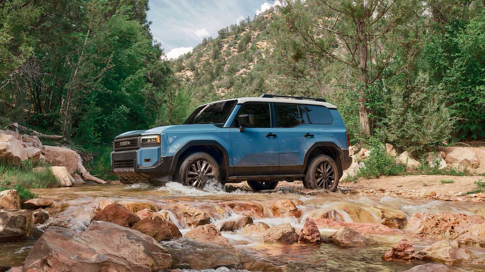 2025 Toyota Land Cruiser in blue driving across stream
