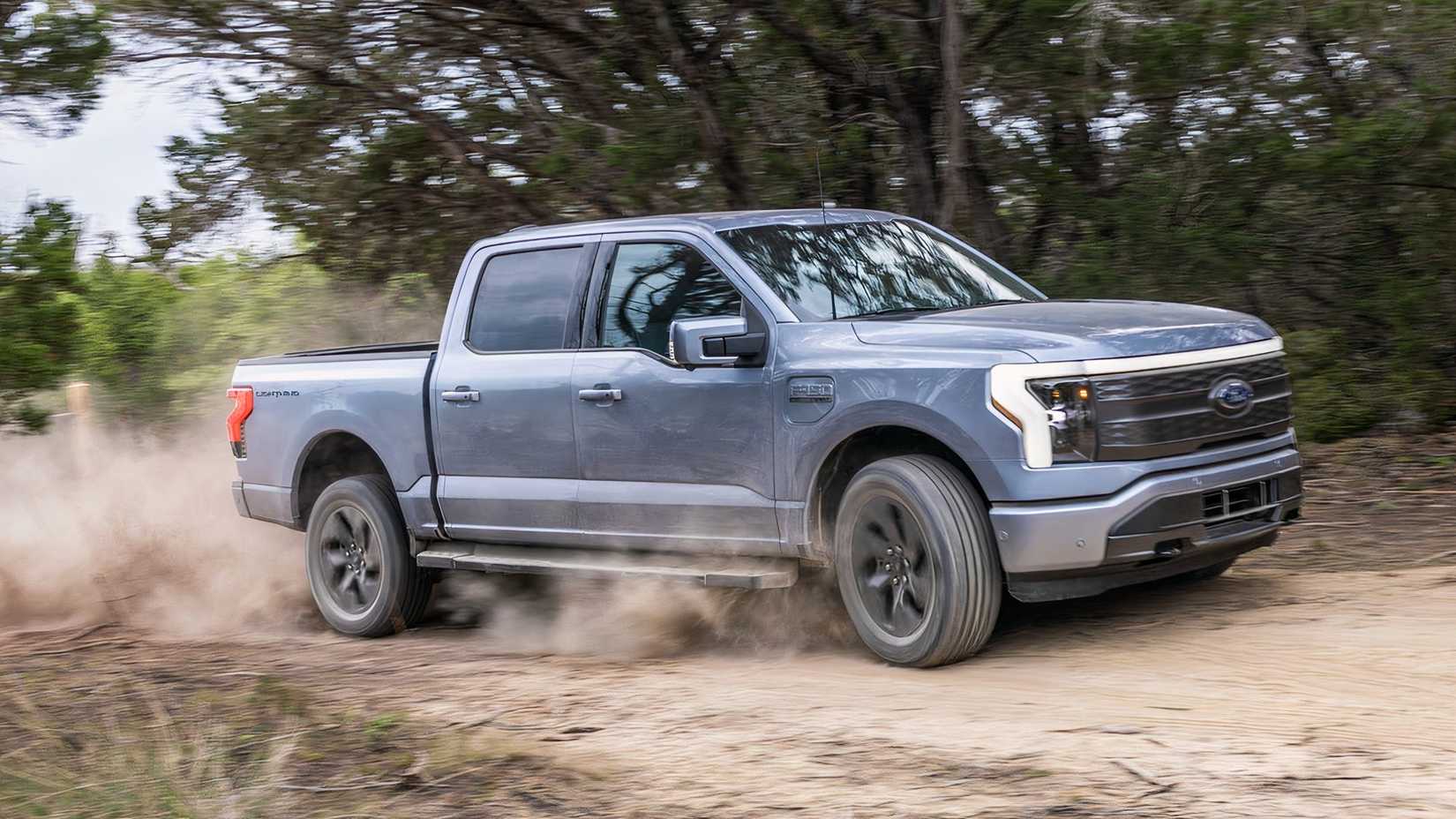 2025 Ford F-150 Lightning profile shot driving off-road
