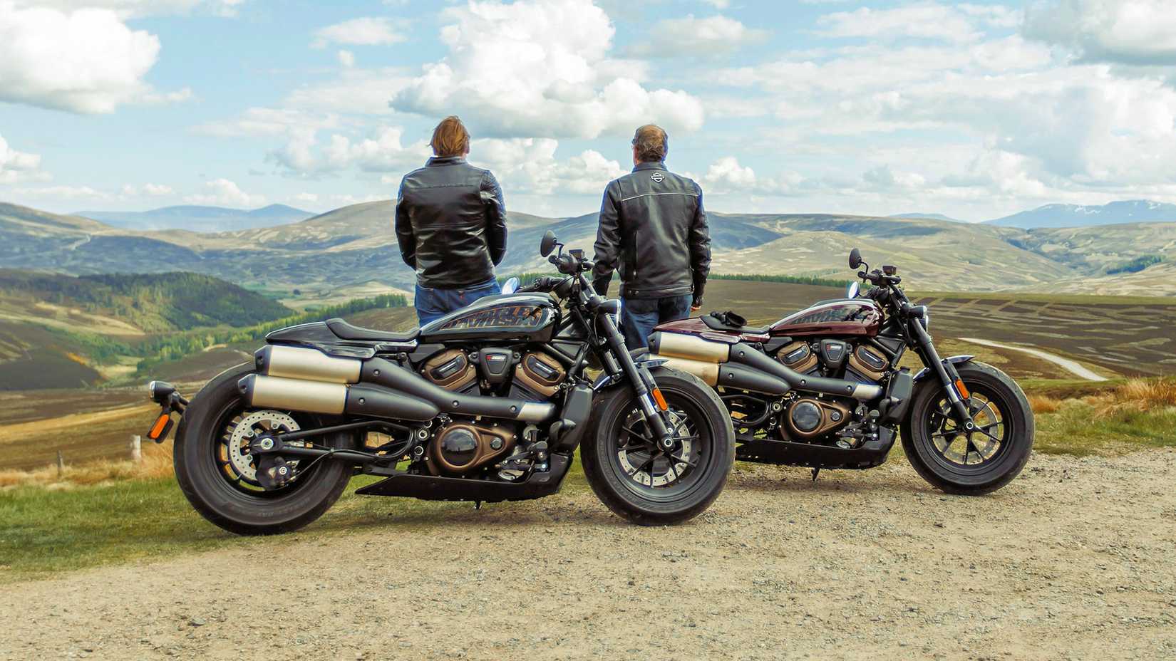 Riders standing next to a pair of 2021 Harley-Davidson Sportster S motorcycles