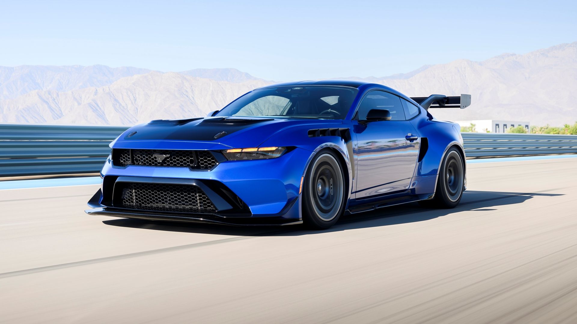 2026 Ford Mustang GTD front three-quarter in blue on track