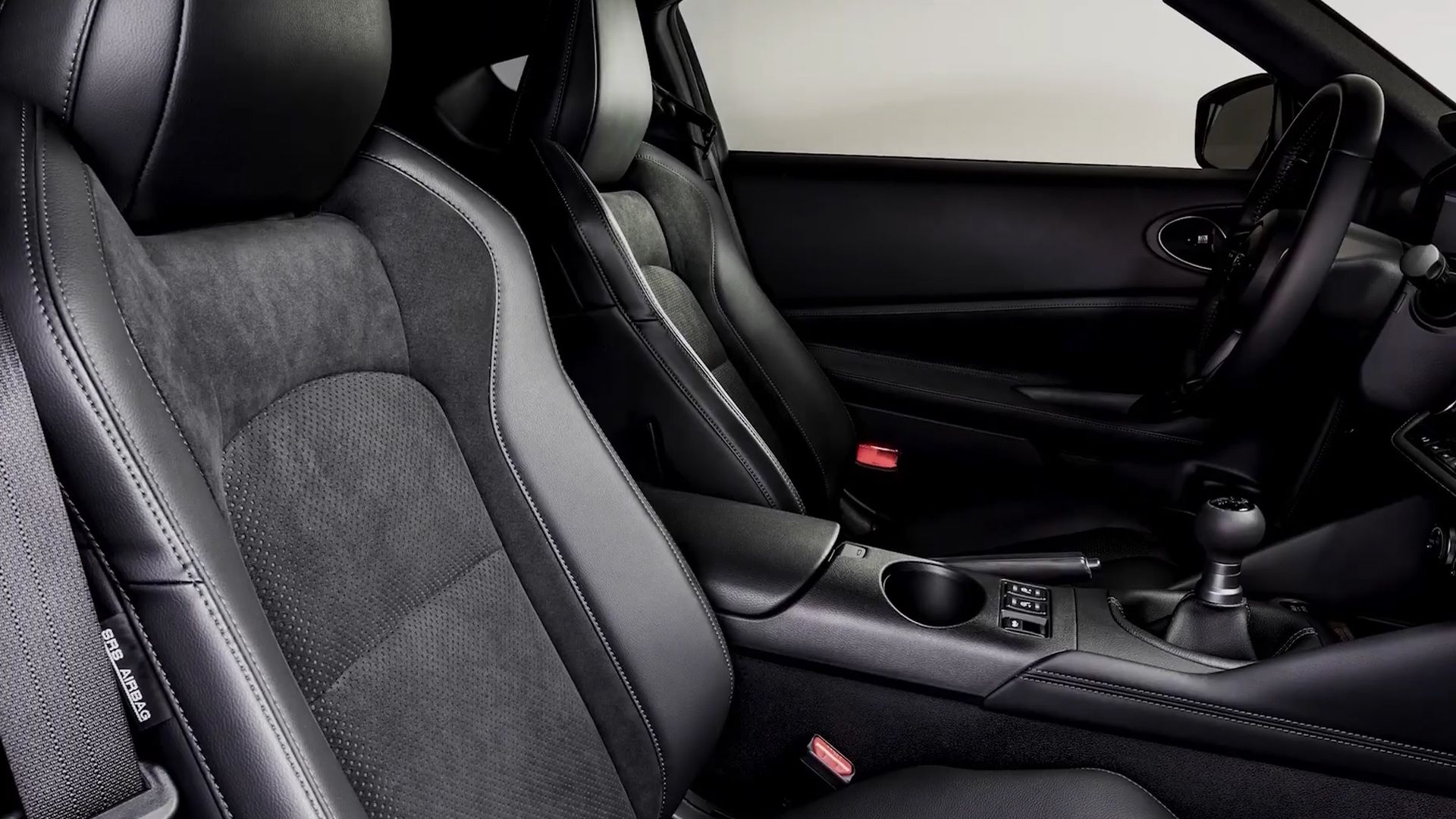 Leather-wrapped steering wheel and aluminium sport pedals inside the Z Performance