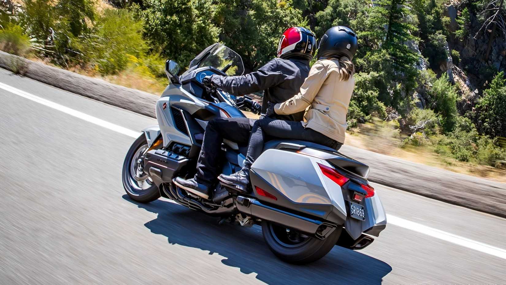 2020 Honda Gold Wing touring with rider and pillion rear cinematic shot