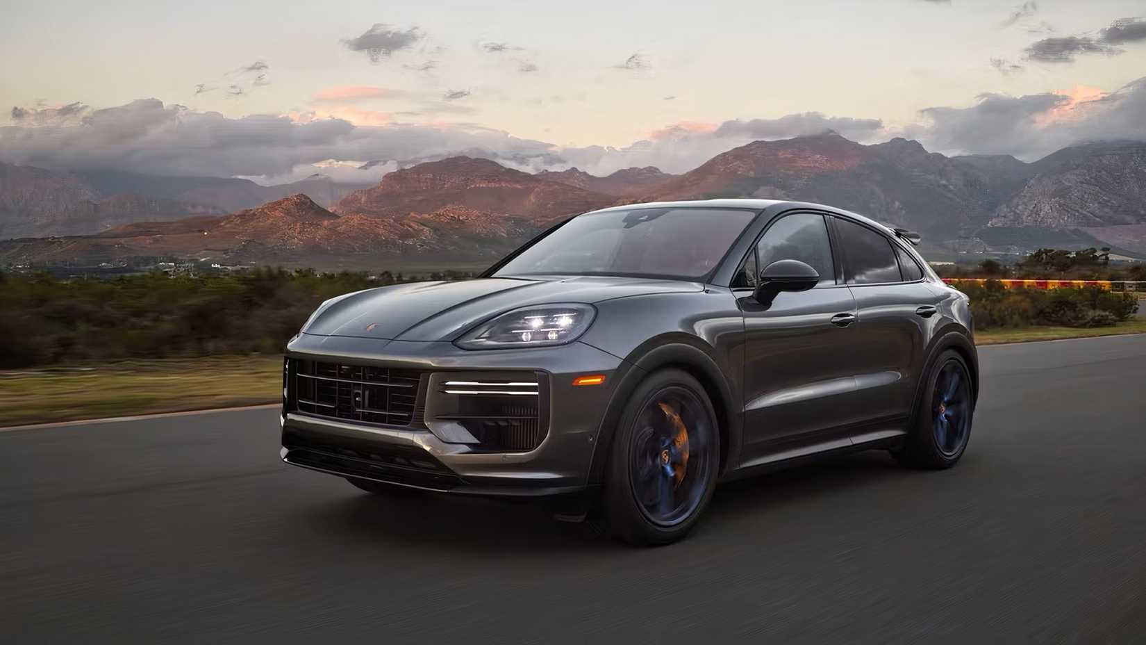 2025 Porsche Cayenne Turbo GT in gray being driven