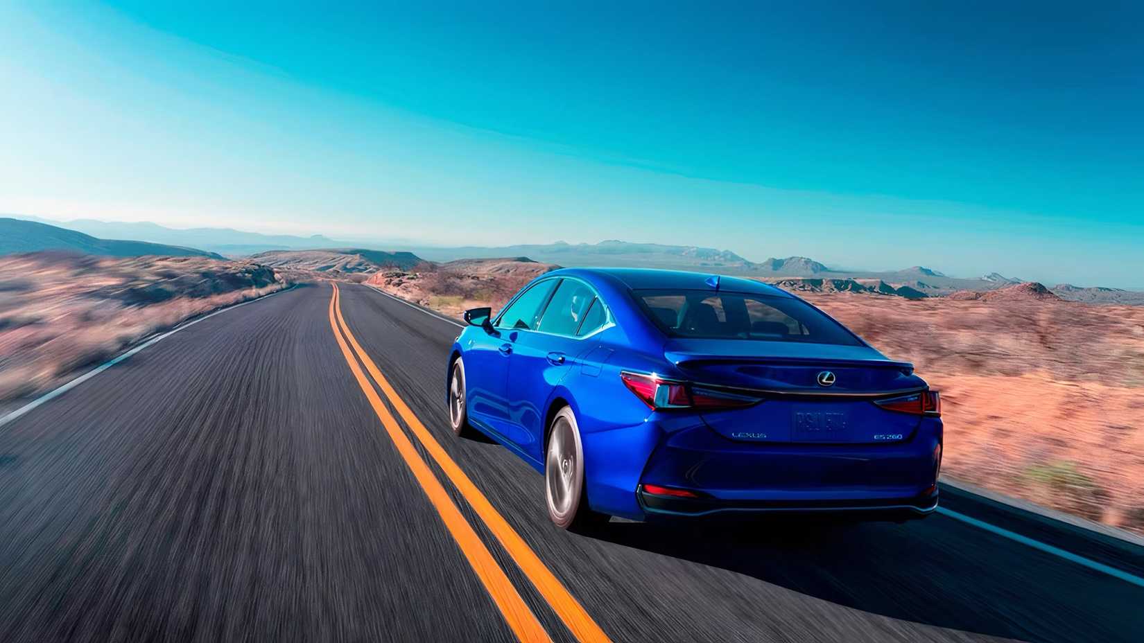 2025 Lexus ES in blue being driven on desert road