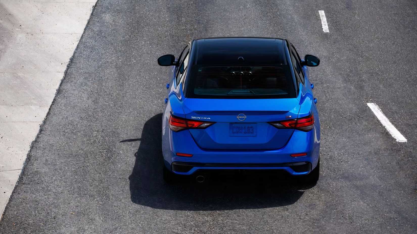 2025 Nissan Sentra in blue being driven on road