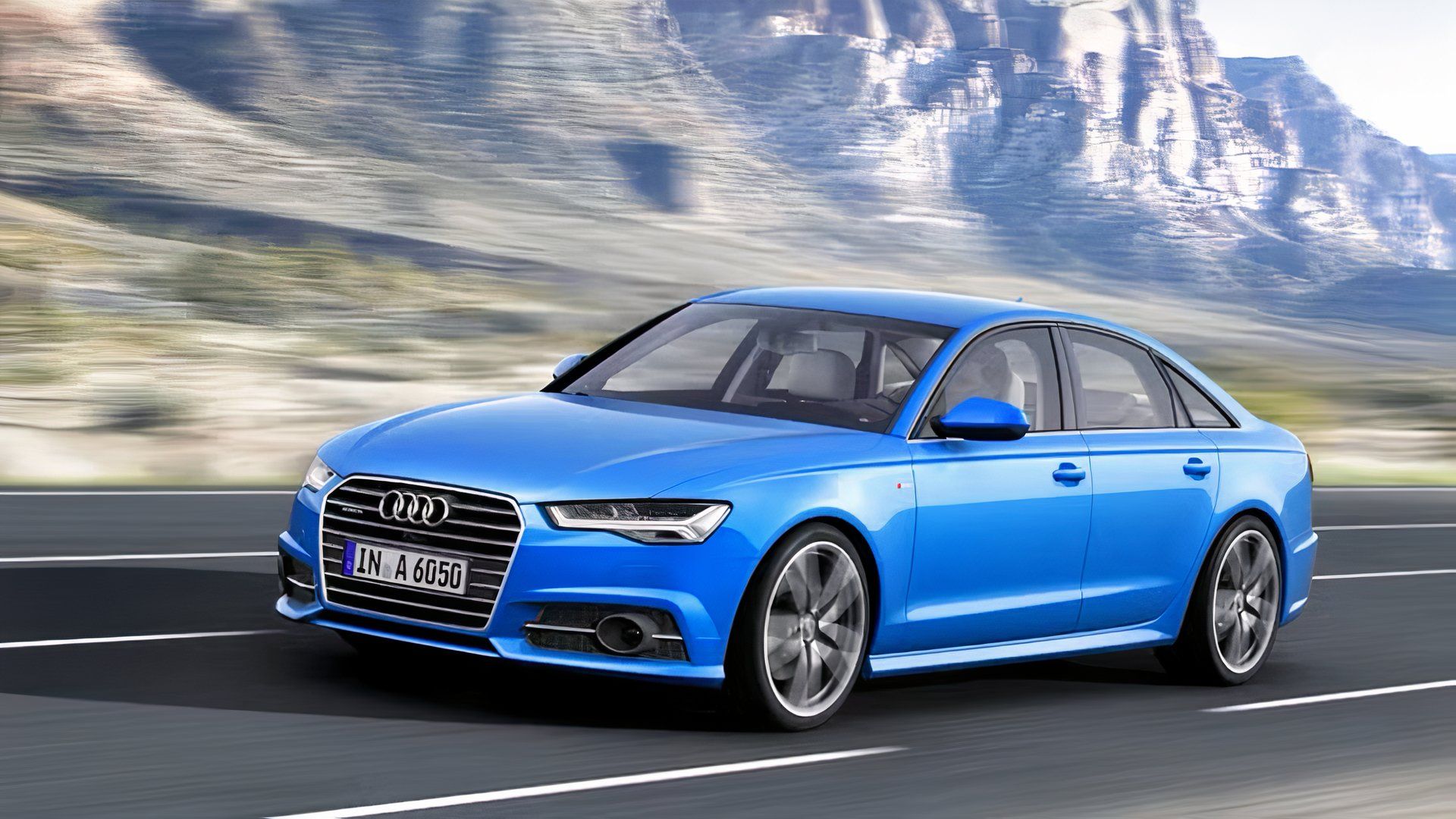 2010 Audi A6 in blue being driven on road