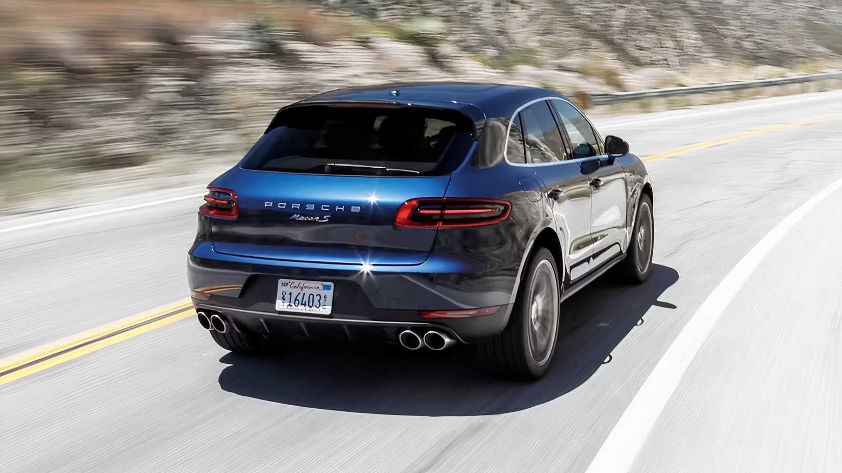 2015 Porsche Macan S in blue being driven on road