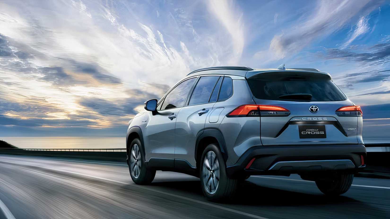 2025 Toyota Corolla Cross in blue being driven on road