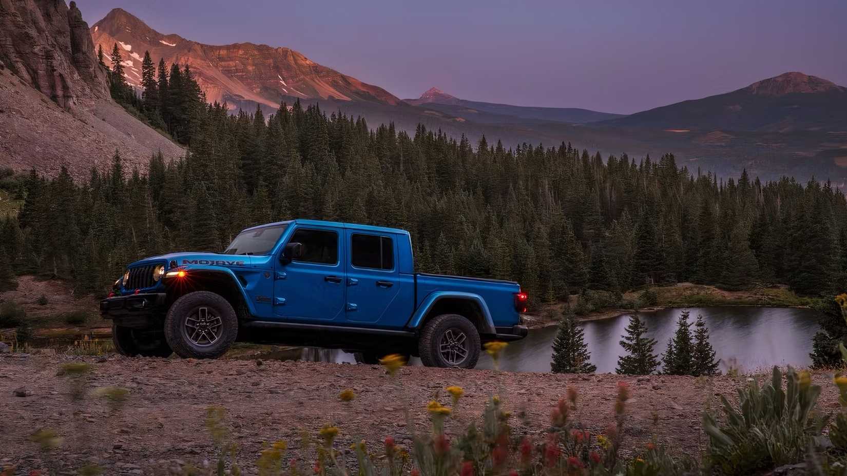 2025 Jeep Gladiator in blue parked off-road