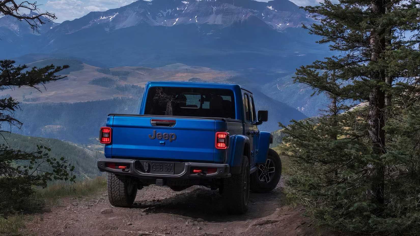 2025 Jeep Gladiator in blue parked off-road