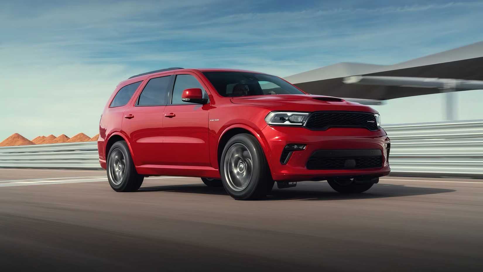 Front 3/4 action shot of 2025 Dodge Durango in red being driven on track