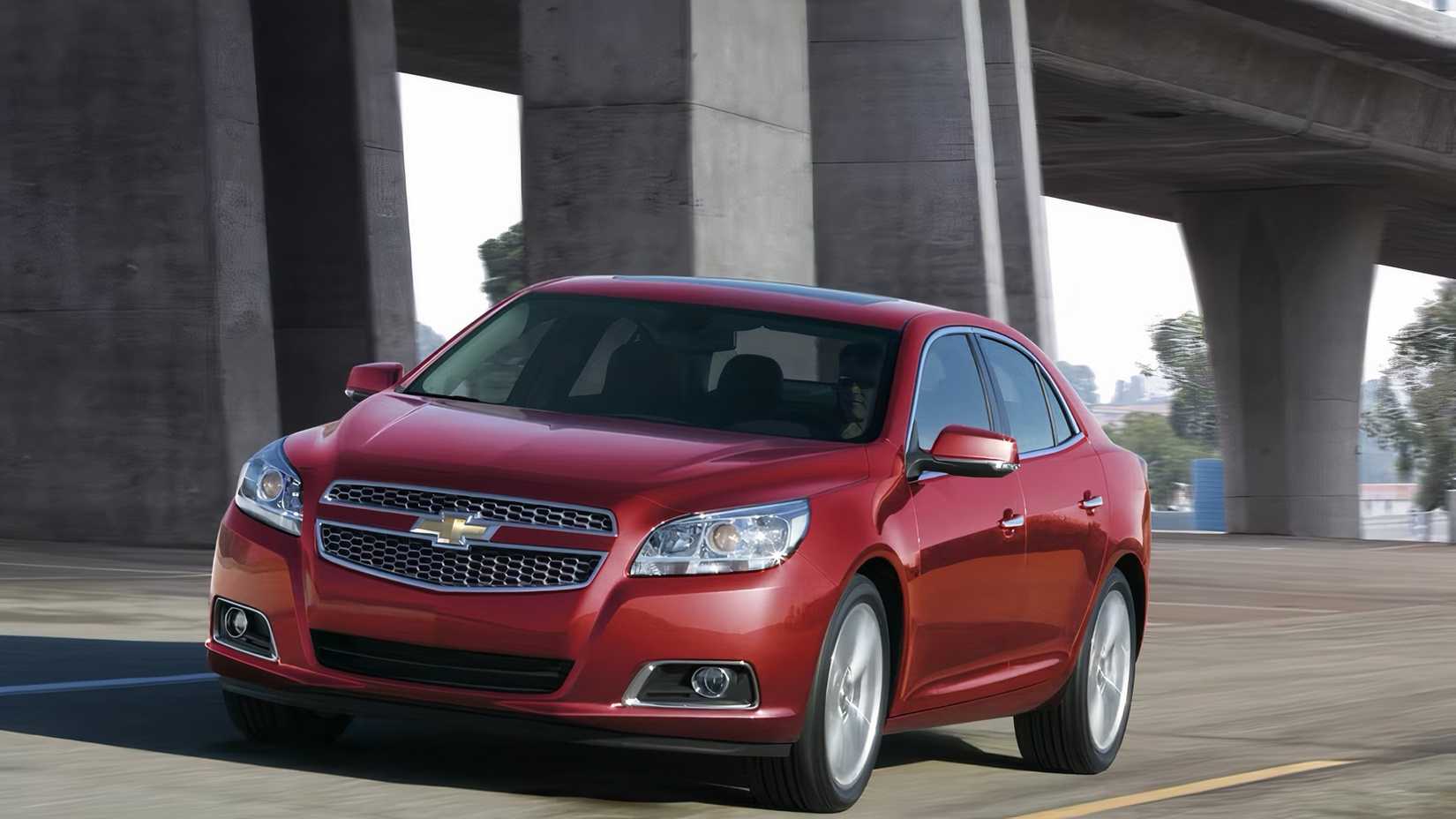  2015 Chevrolet Malibu in red being driven on road