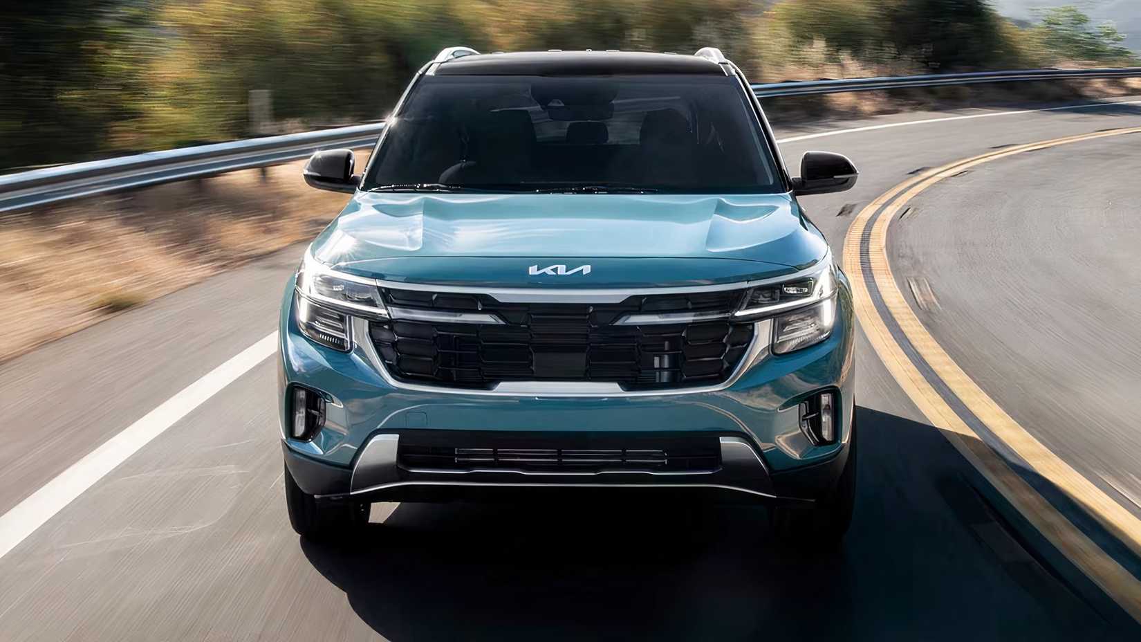 2025 Kia Seltos in blue being driven on road