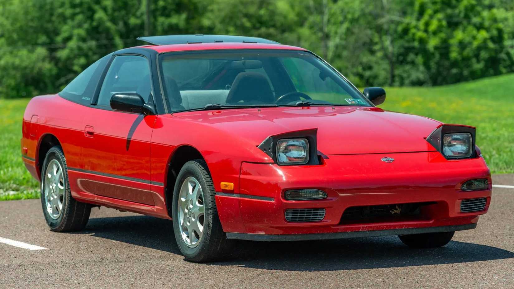 1991 Nissan 240SX SE in red parked