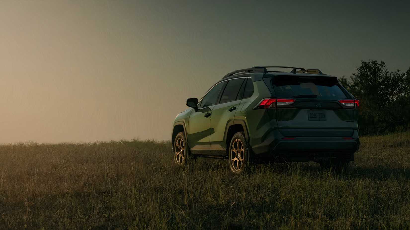 2025 Toyota RAV4 in green parked off-road