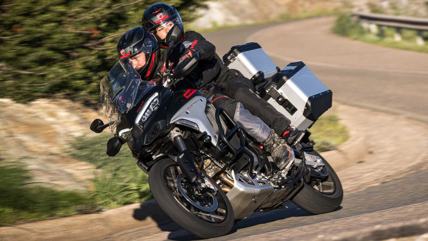 2025 Ducati Multistrada V4 Rally cornering with pillion and panniers