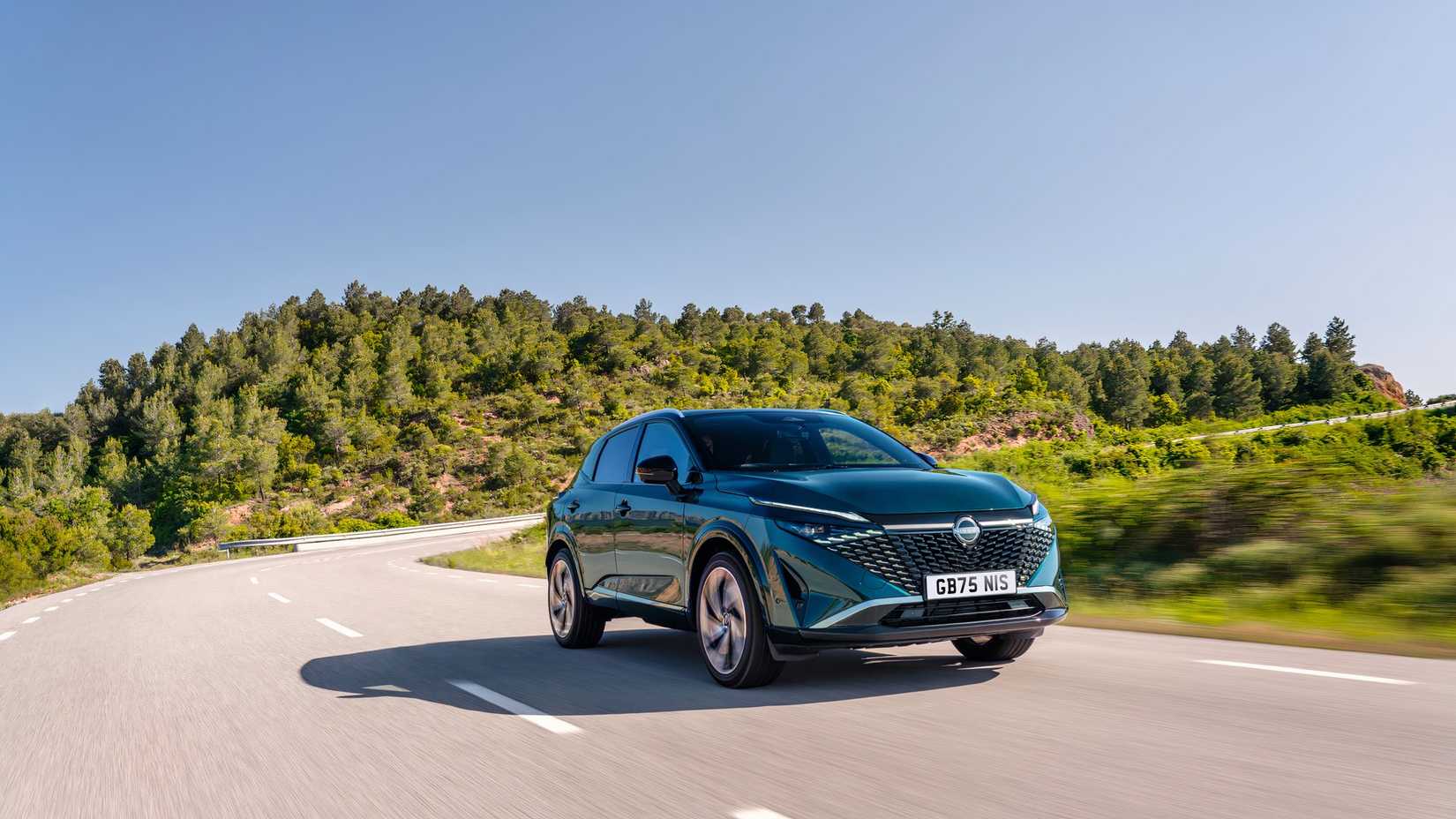 2025 Nissan Qashqai e-POWER in blue driving on road