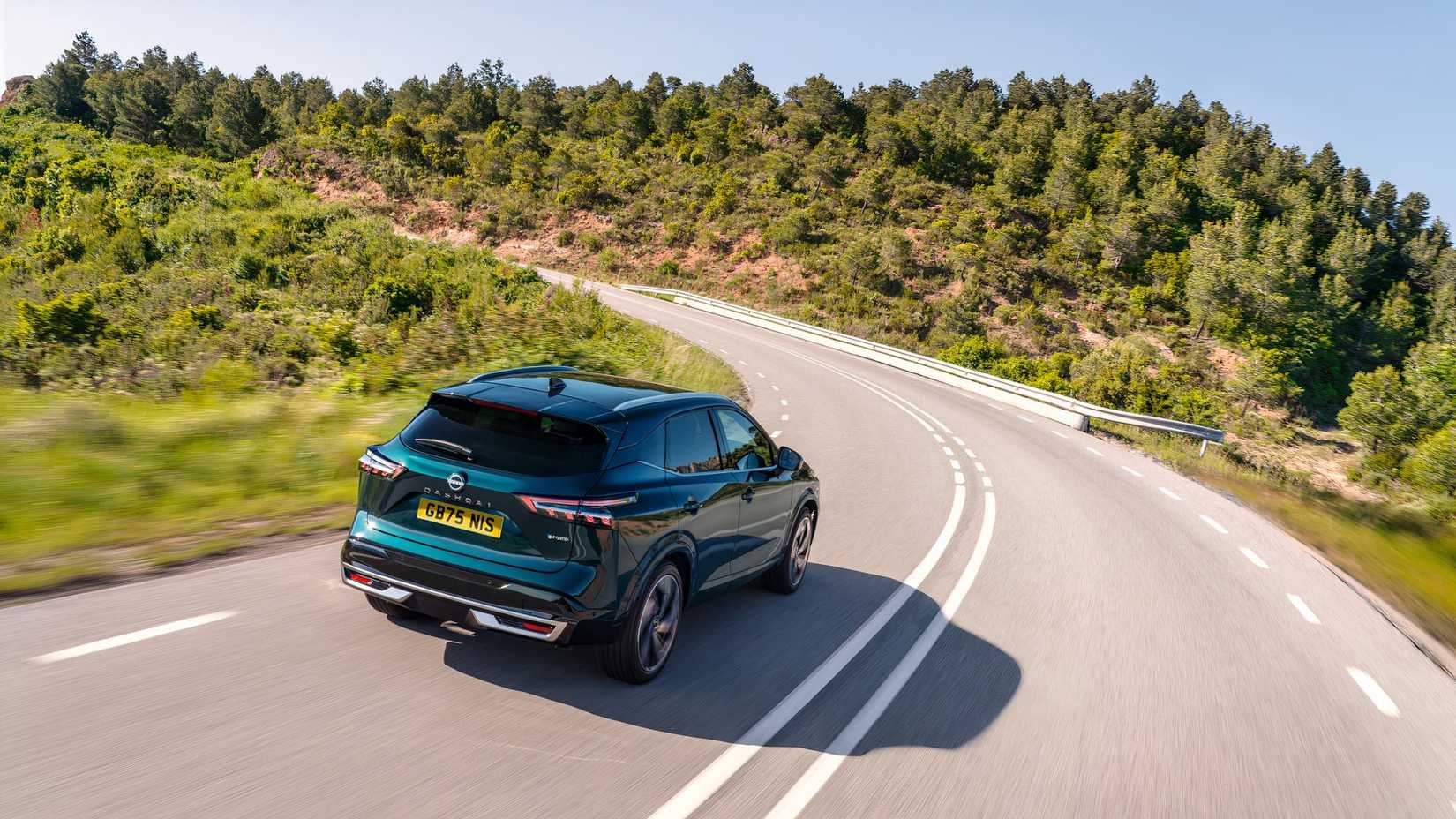 2025 Nissan Qashqai e-POWER in blue driving on road