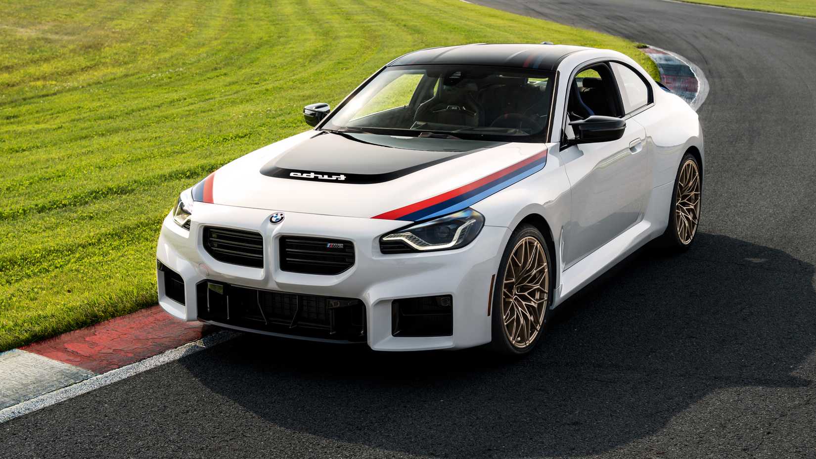 2026 BMW M2 Turbo Design Edition in white being driven on track