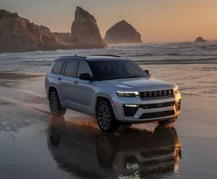 2026 Jeep Grand Cherokee being driven on the beach